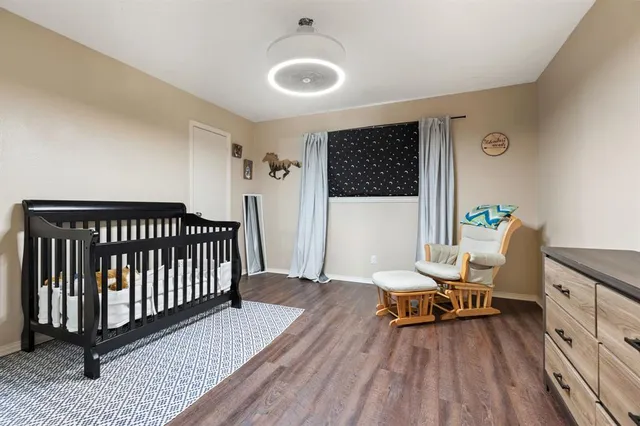 a workspace with wooden floor and a bathroom