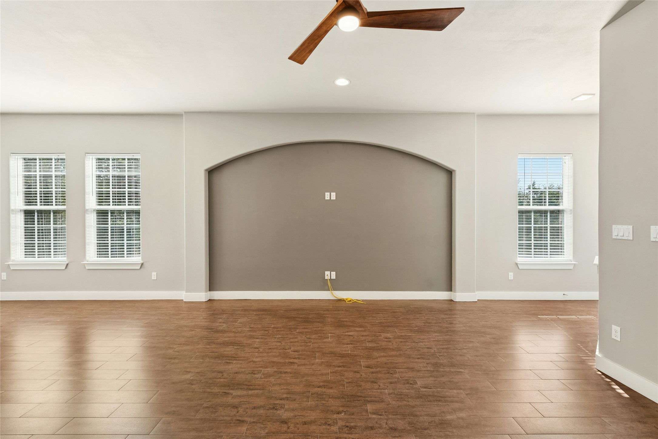 4301 Mansfield Dam Road, Unit 2101 Austin, TX 78734 - Photo 4 of 17 Unfurnished room featuring a ceiling fan, wood finished floors, and recessed lighting