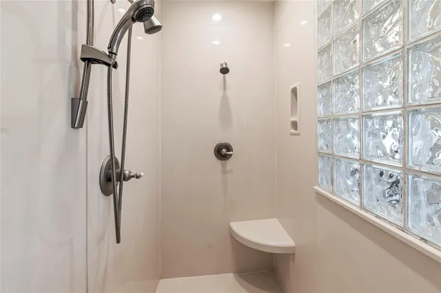 a view of a swimming pool with a patio and a yard