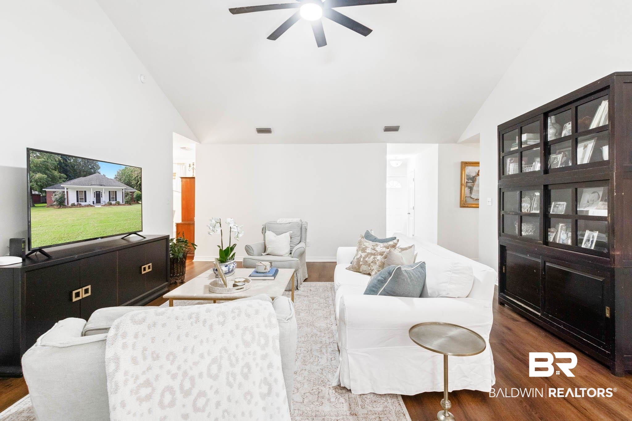 20685 Lowry Drive Fairhope, AL 36532 - Photo 13 of 48 Living area with wood finished floors, high vaulted ceiling, and a ceiling fan