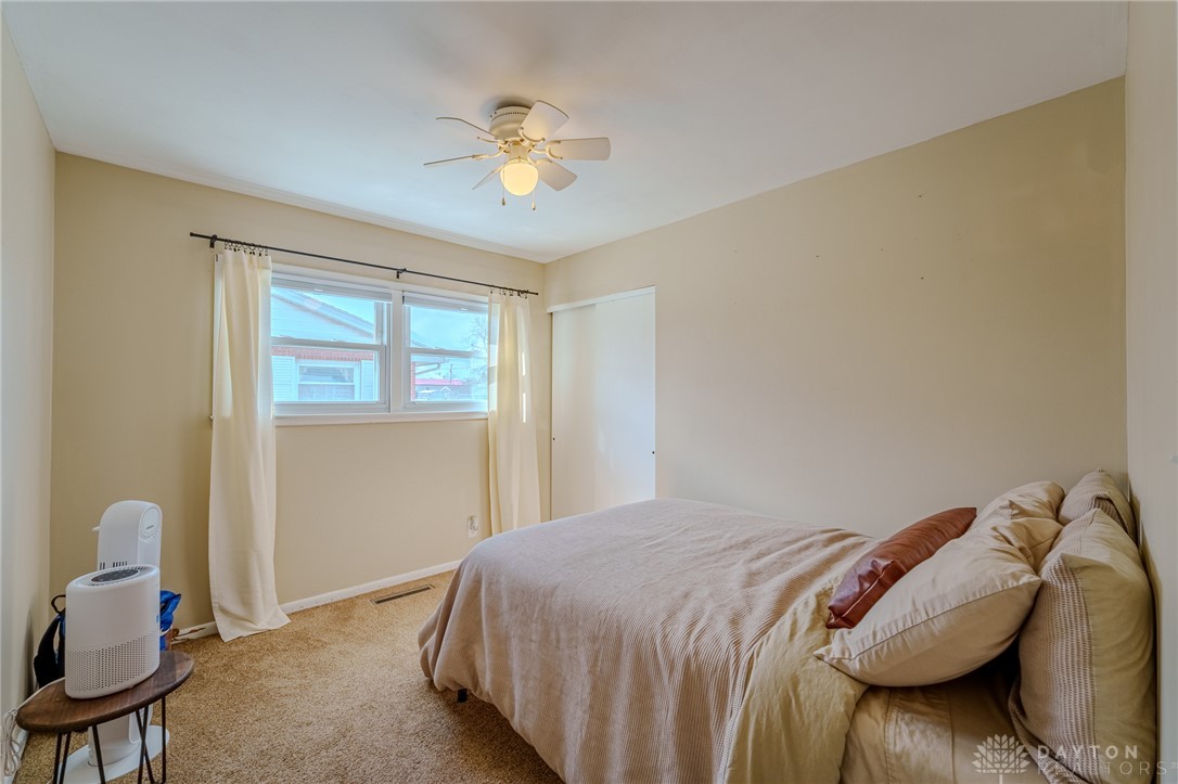 305 South Vandemark Road Sidney, OH 45365 - Photo 29 of 32 This cozy bedroom features ample natural light and a comforting atmosphere for peaceful relaxation.