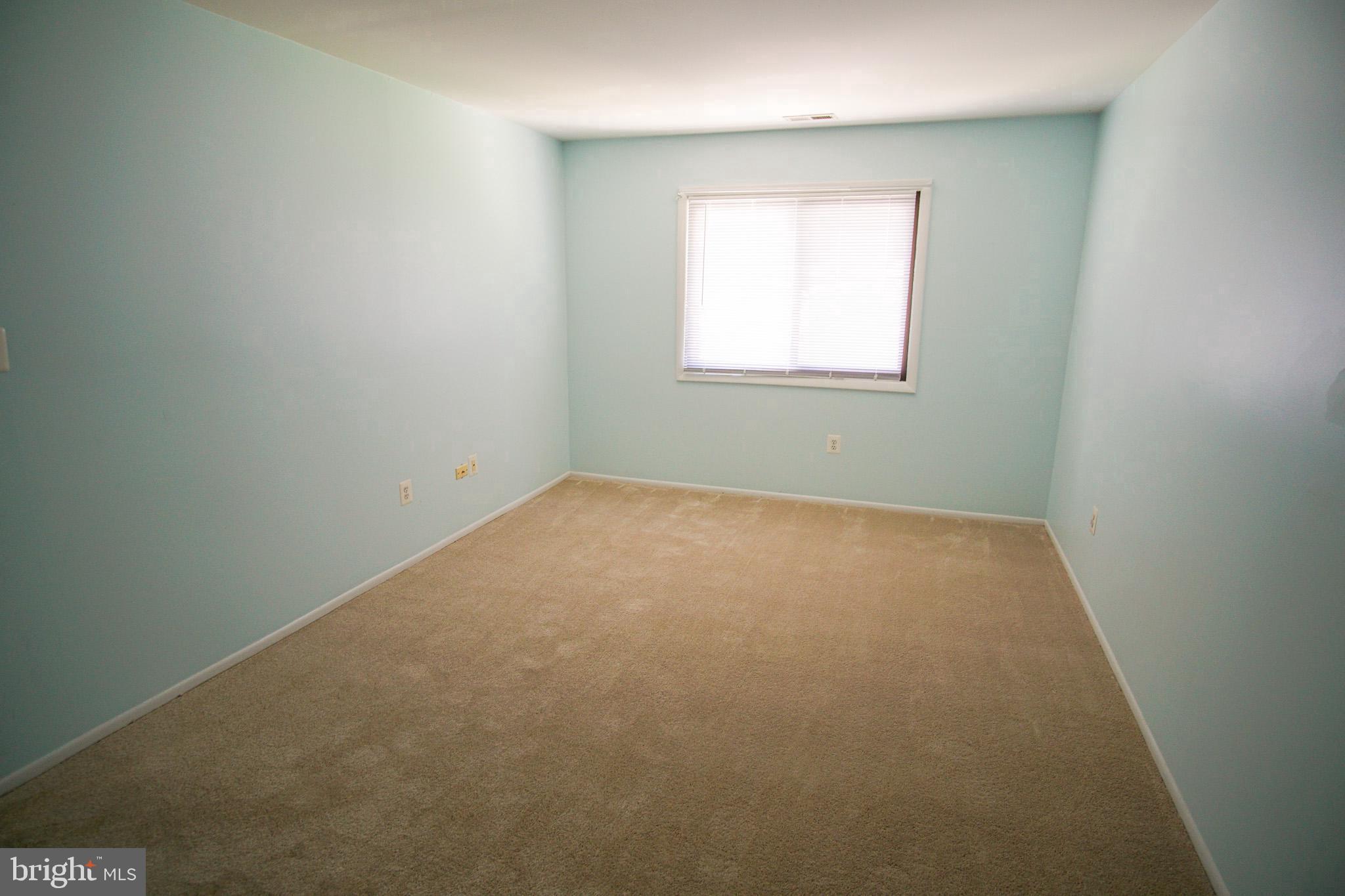 7 Mariners Way, Unit 2 Stevensville, MD 21666 - Photo 12 of 25 Spacious room with soft blue walls.