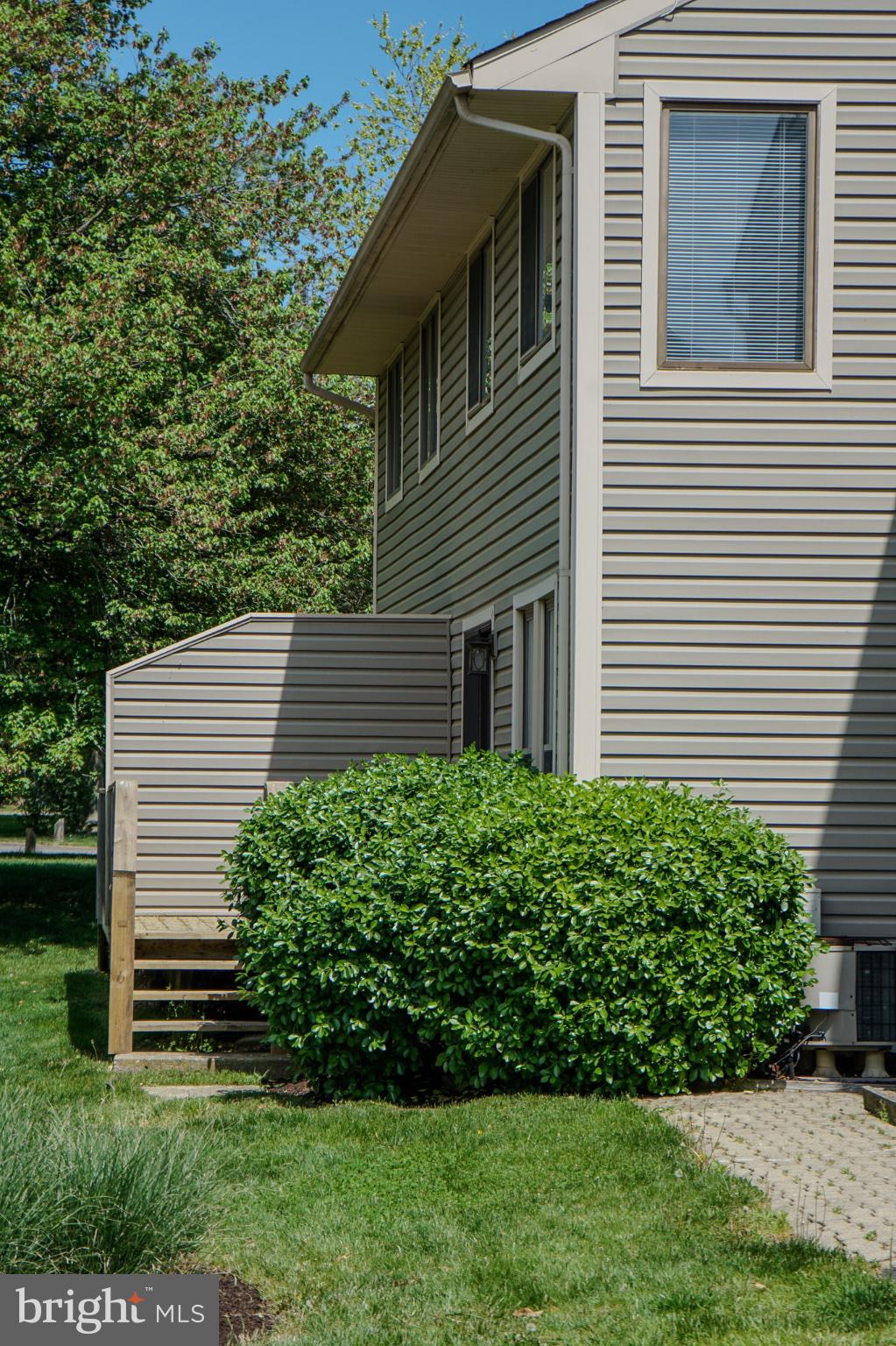 7 Mariners Way, Unit 2 Stevensville, MD 21666 - Photo 21 of 25 Charming home with lush greenery.