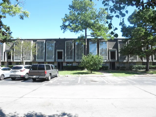 a view of street with parked cars