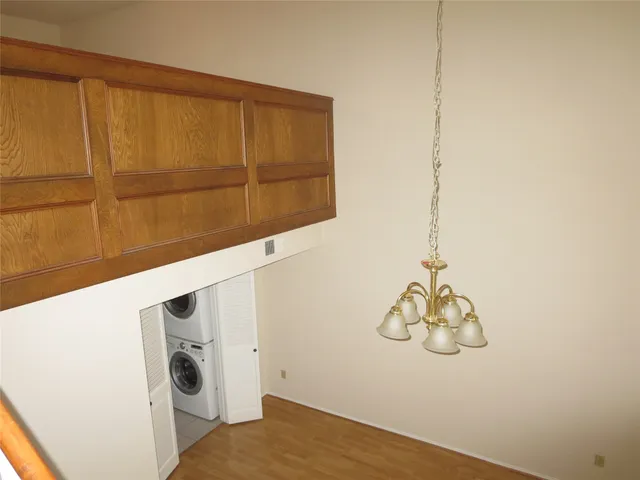 a view of a small space with wooden floor