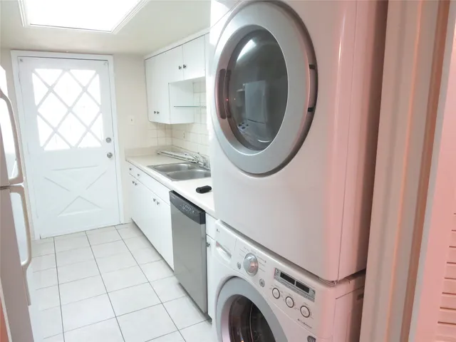 a kitchen with a washer and dryer