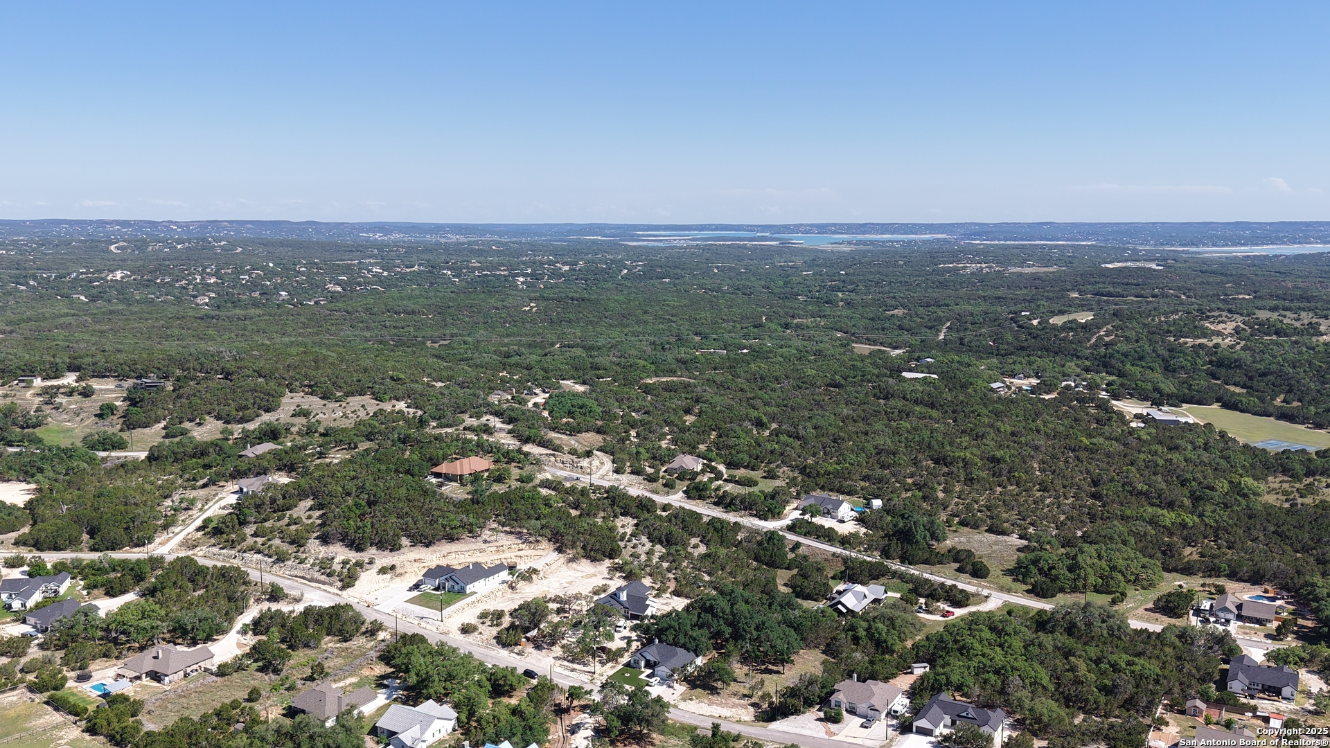 an aerial view of house with yard