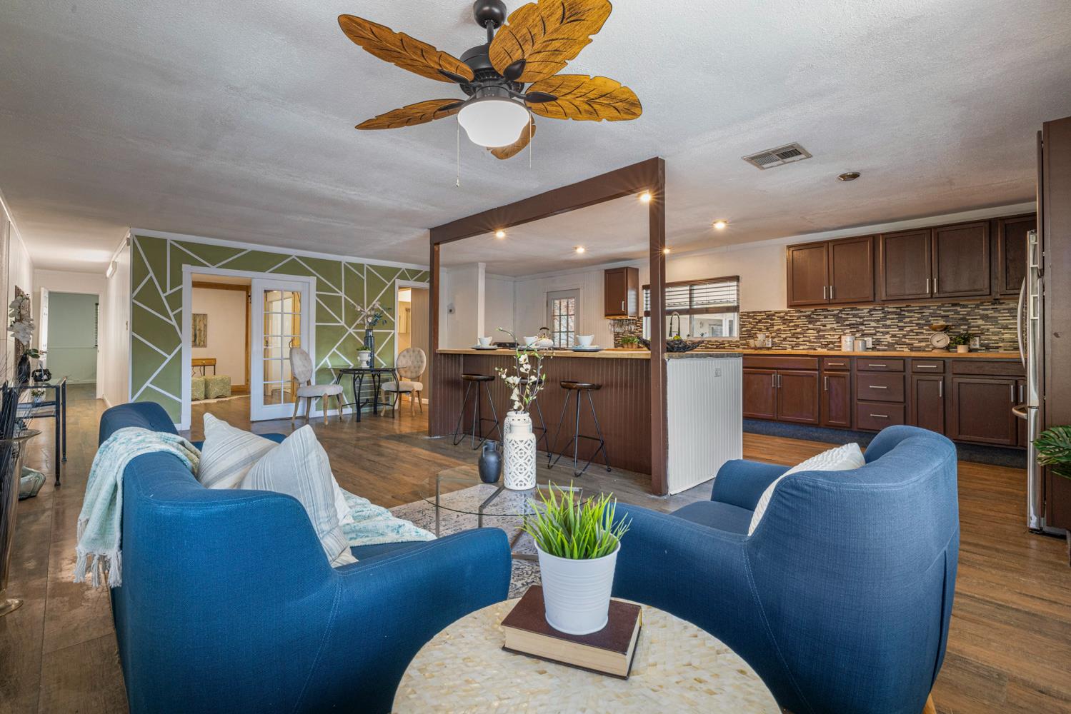 2621 Prescott Road, Unit 79 Modesto, CA 95350 - Photo 13 of 41 a living room with furniture kitchen view and a chandelier