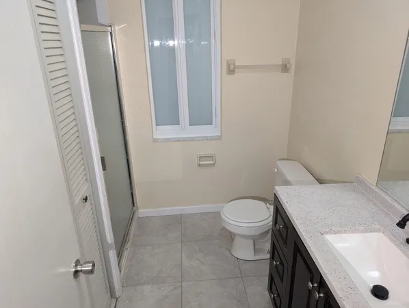 a bathroom with a sink and toilet