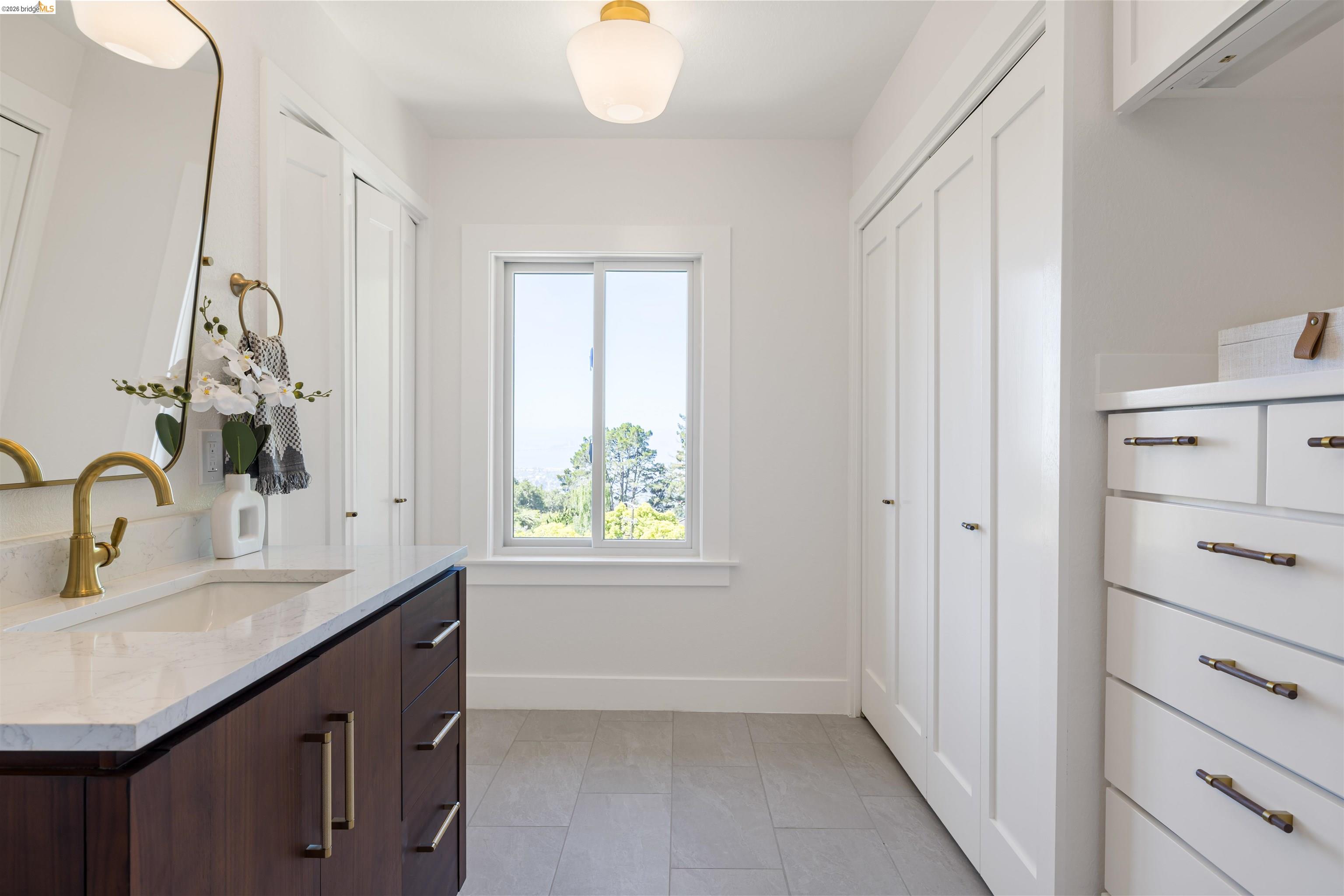 900 Euclid Avenue Berkeley, CA 94708 - Photo 25 of 54 a bathroom with a sink vanity and a mirror