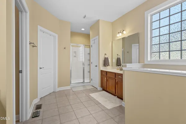 a bathroom with a bathtub and a window