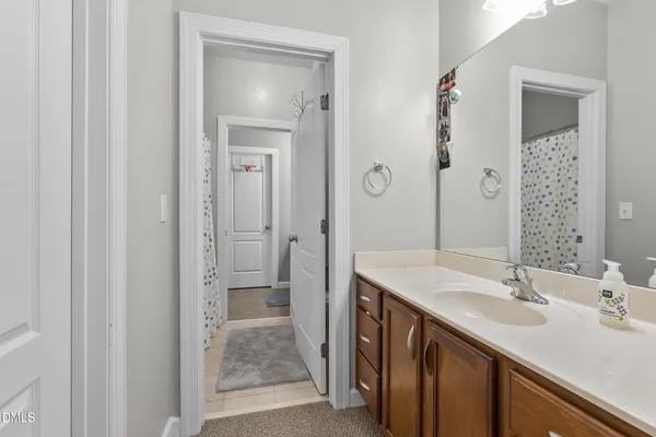 a bathroom with 2 sink and a mirror