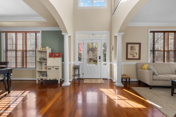 a living room with furniture window and a table