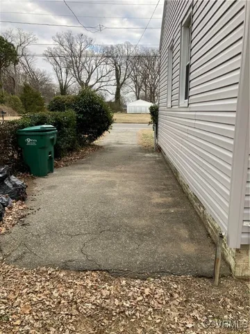 a view of living room with furniture and chandelier