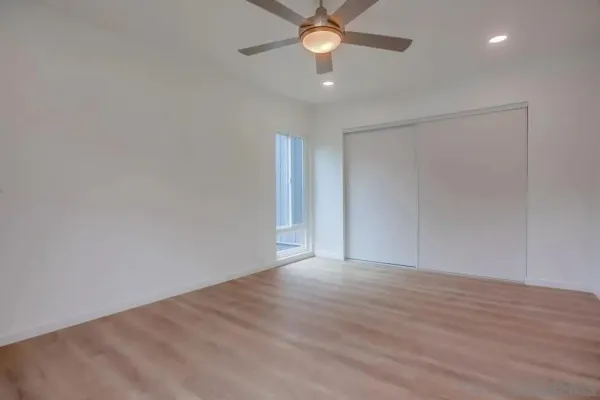 a view of an empty room with a window