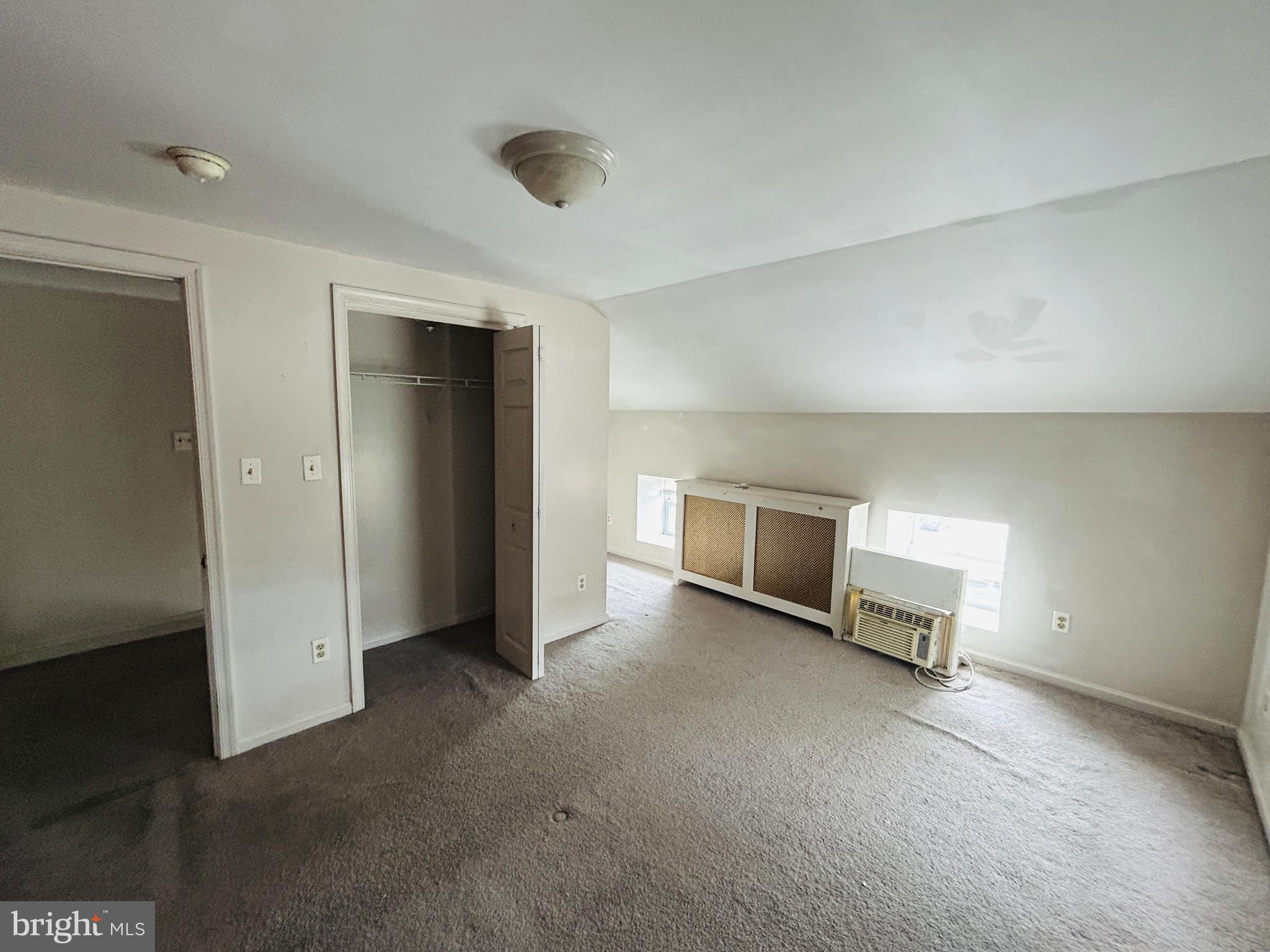 6500 Ridge Avenue, Unit 2 Philadelphia, PA 19128 - Photo 13 of 17 an empty room with a bench and a window