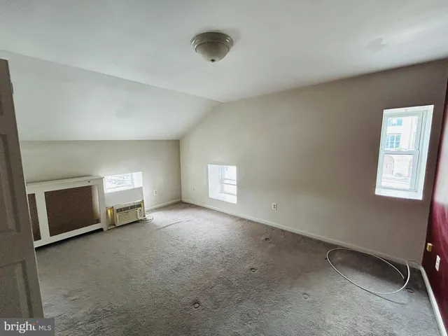 a view of a livingroom and a fireplace