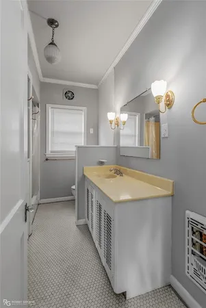 a view of a kitchen with a sink and cabinets