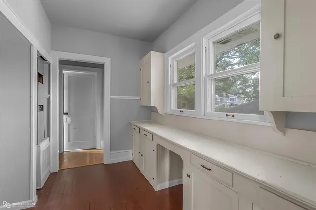 a view of a kitchen cabinets and a window