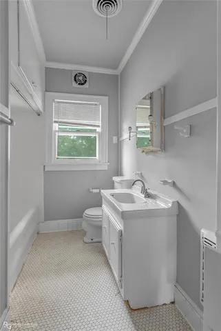 a bathroom with a sink a toilet and tub