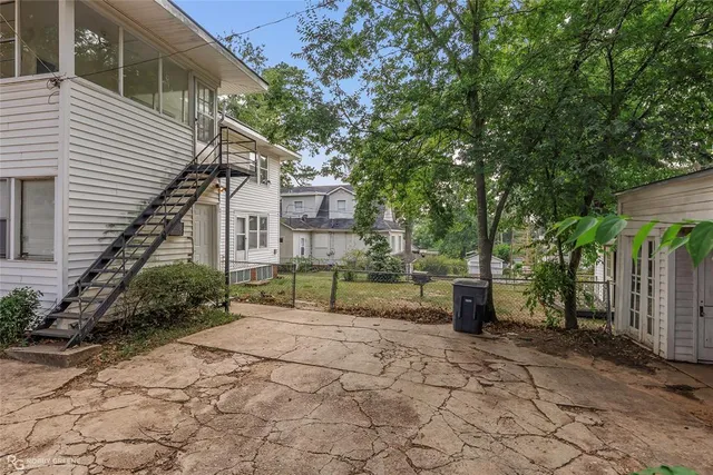 a house with a tree in the background