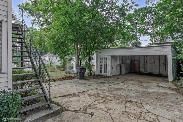 a view of a house with a tree in the background