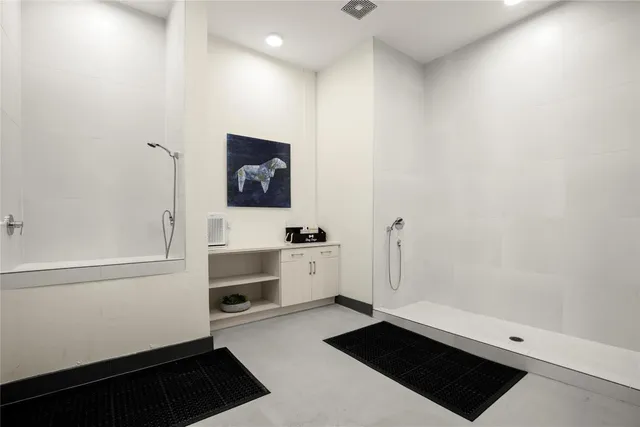 a view of a hallway with washer and dryer