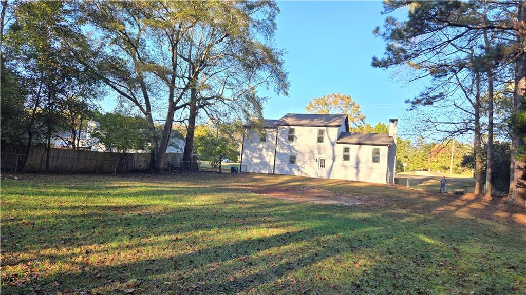 491 Glen Terrace Road Auburn, GA 30011 - Photo 2 of 19 a view of a yard with a house in the background