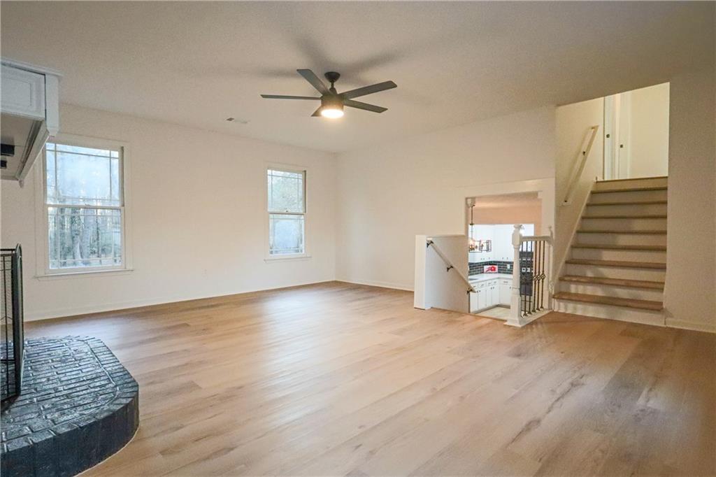491 Glen Terrace Road Auburn, GA 30011 - Photo 4 of 19 a view of empty room with wooden floor and fan