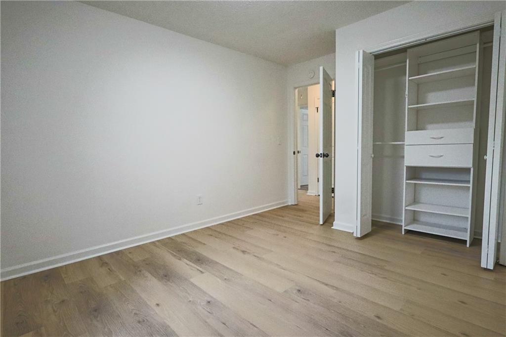 491 Glen Terrace Road Auburn, GA 30011 - Photo 8 of 19 wooden floor in an empty room