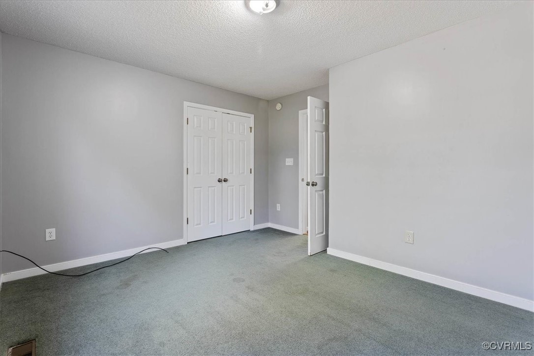 4713 Takach Road Prince George, VA 23875 - Photo 27 of 35 Unfurnished room with dark colored carpet and a te