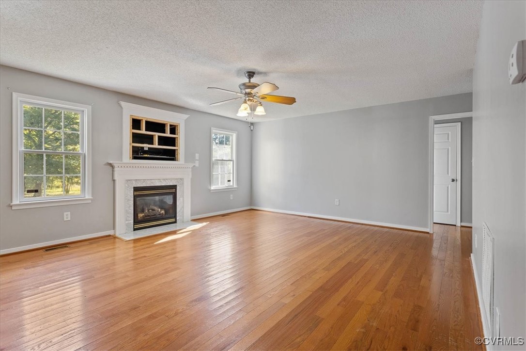 4713 Takach Road Prince George, VA 23875 - Photo 10 of 35 Unfurnished living room featuring a wealth of natu