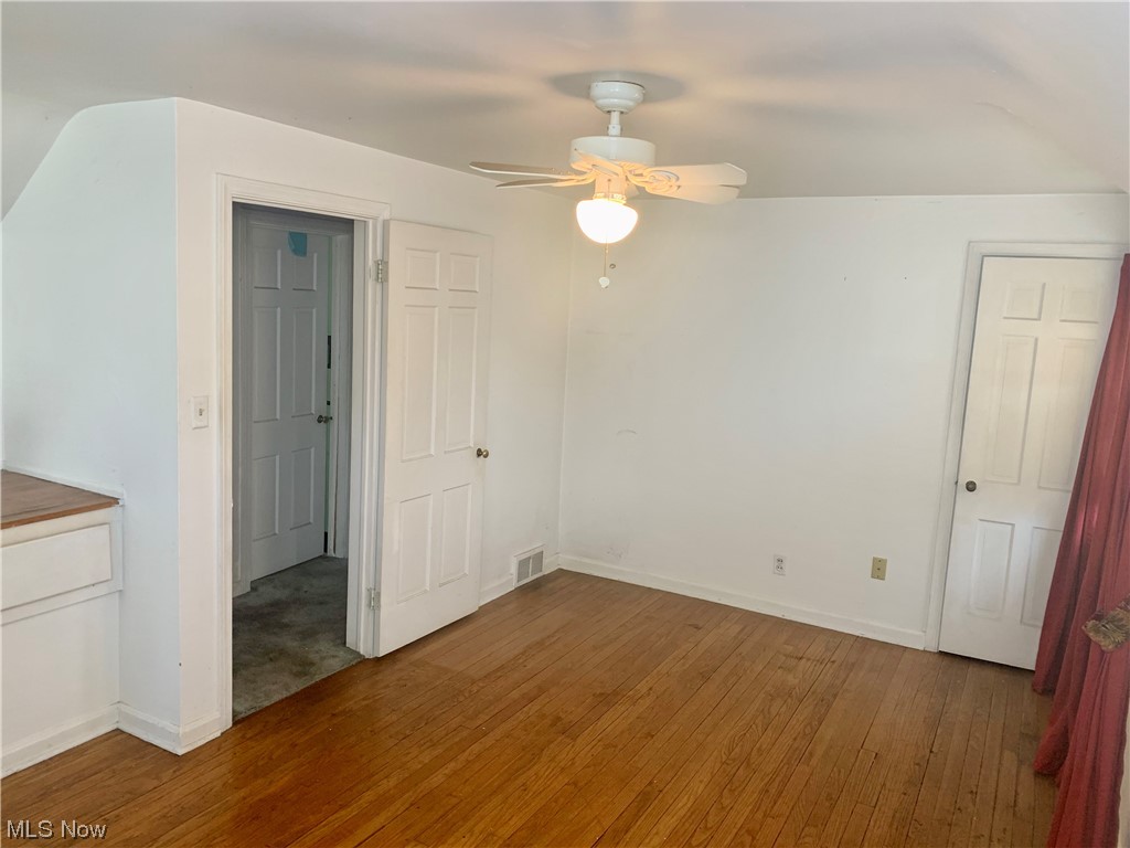 665 Dorchester Road Akron, OH 44320 - Photo 14 of 18 Unfurnished room featuring ceiling fan and hardwood / wood-style flooring