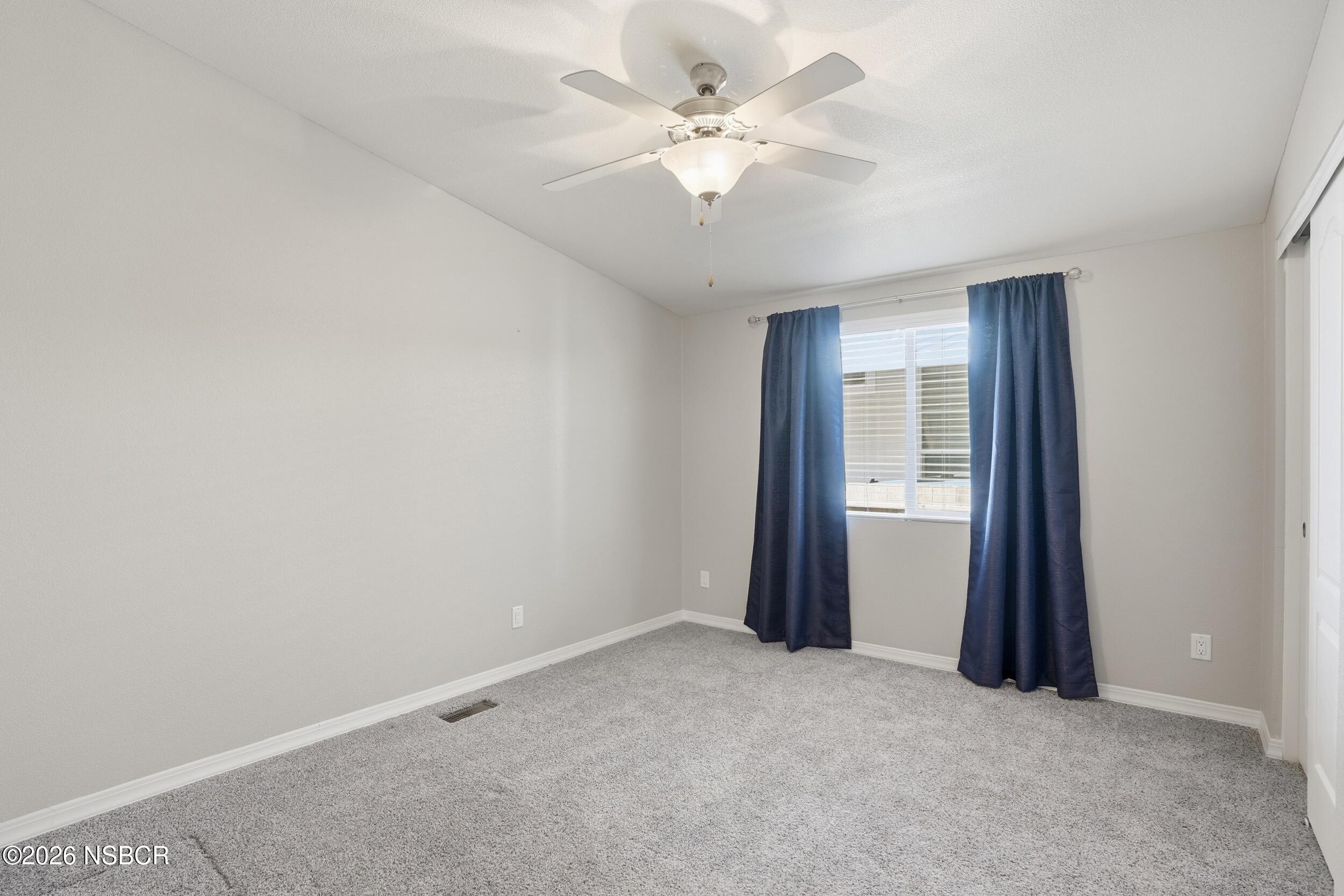 500 Atascadero Road, Unit M3 Morro Bay, CA 93442 - Photo 19 of 29 an empty room with windows and fan