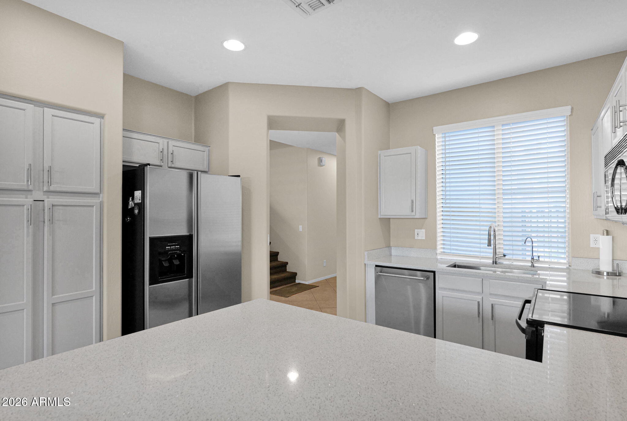1024 East Frye Road, Unit 1092 Phoenix, AZ 85048 - Photo 11 of 35 a kitchen with stainless steel appliances a refrigerator and a sink