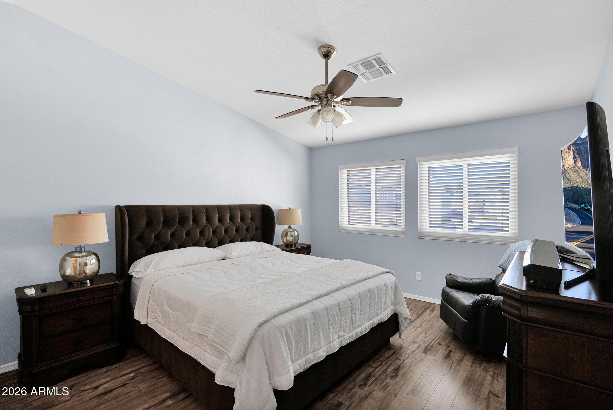 1024 East Frye Road, Unit 1092 Phoenix, AZ 85048 - Photo 16 of 35 a bedroom with a bed and wooden floor