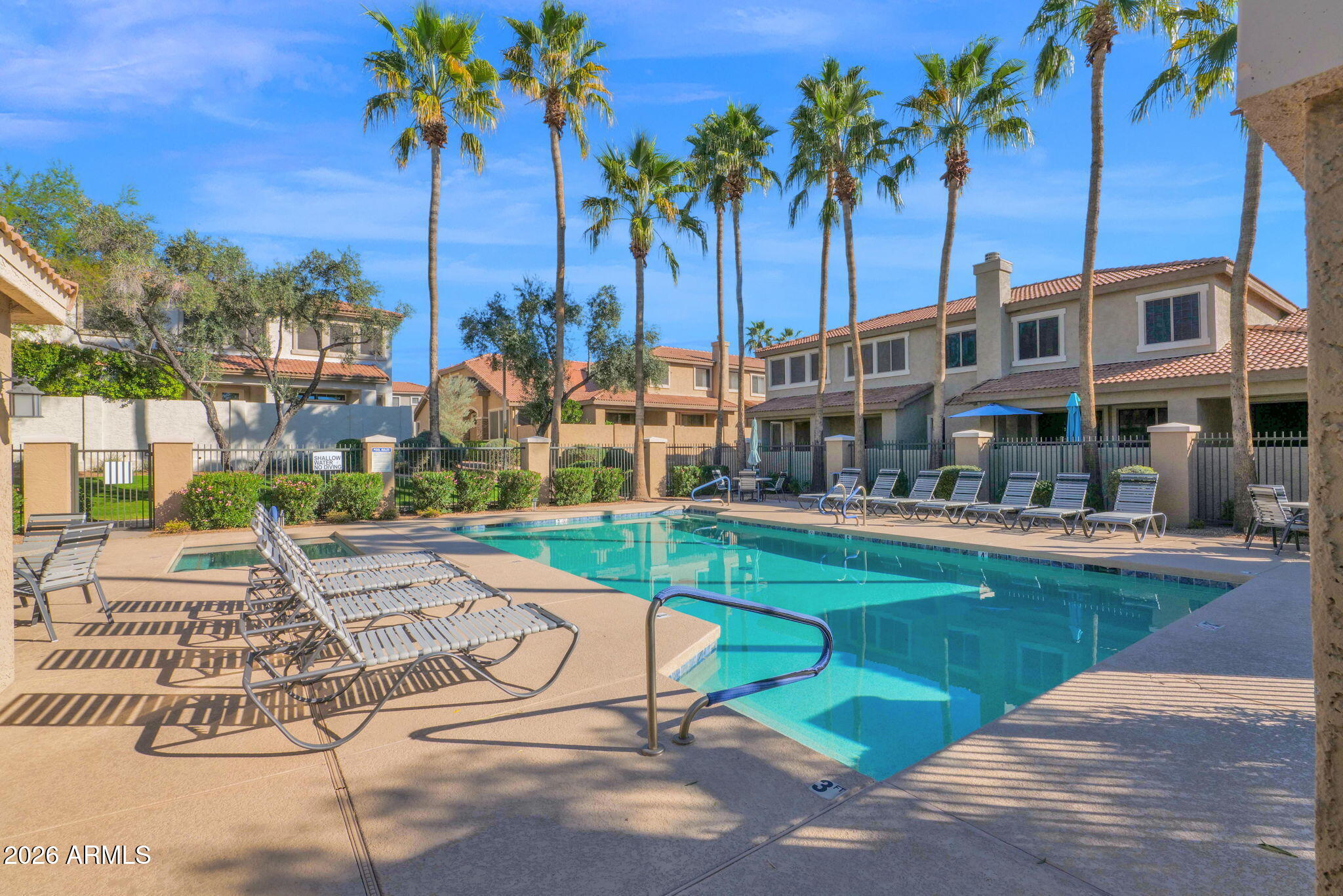 1024 East Frye Road, Unit 1092 Phoenix, AZ 85048 - Photo 32 of 35 a view of a swimming pool with a table and chairs