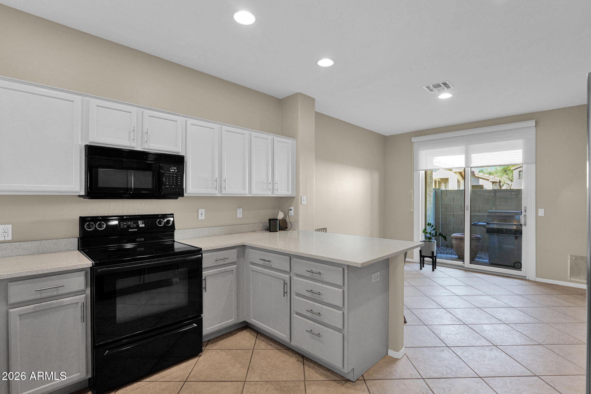 1024 East Frye Road, Unit 1092 Phoenix, AZ 85048 - Photo 8 of 35 a kitchen with a sink stove and microwave