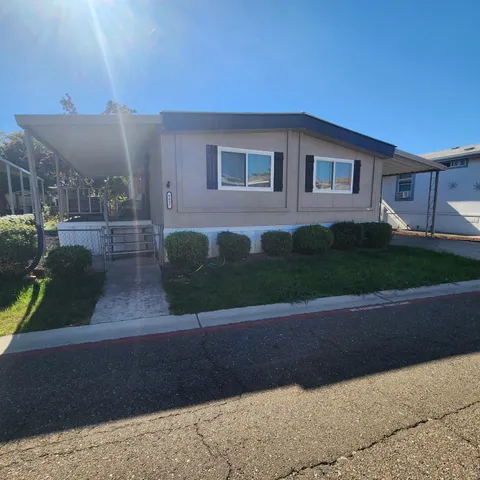 a view of house with yard
