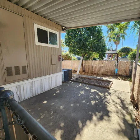 a view of a backyard with a small cabin
