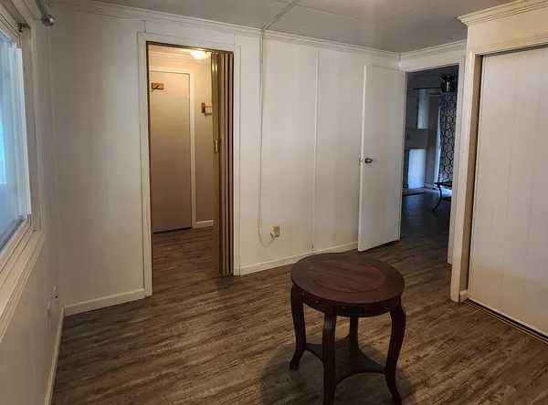 a view of entryway with wooden floor