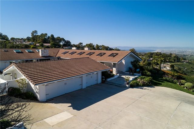 a view of a porch with wooden floor and a fireplace