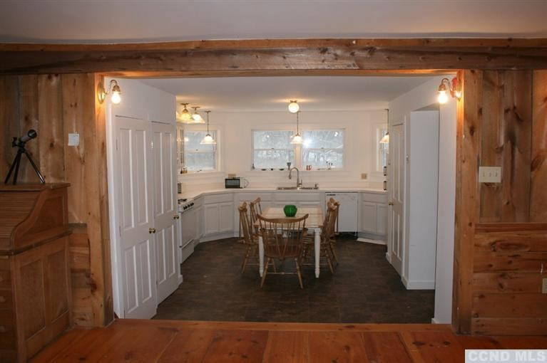 78 Lustig Road Hunter, NY 12485 - Photo 3 of 10 a view of a dining area with furniture and a chandelier