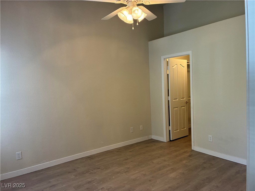 701 Capri Drive, Unit 5C Boulder City, NV 89005 - Photo 8 of 8 Empty room featuring dark wood-style floors and a ceiling fan