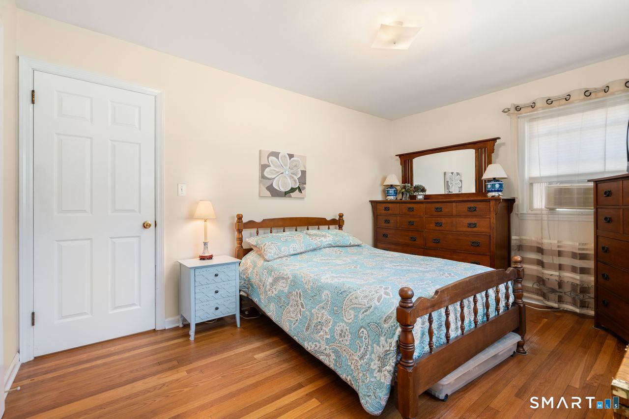 9 Stanton Road North Haven, CT 06473 - Photo 17 of 35 a bedroom with a bed and wooden floor
