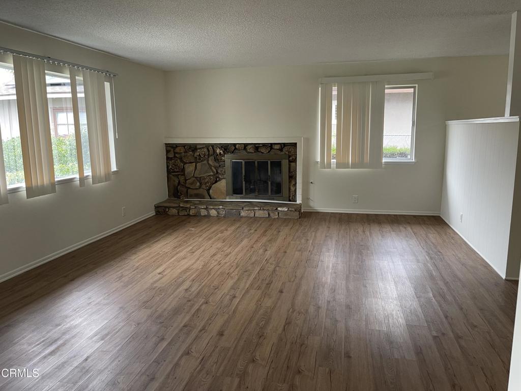1908 Sorrel Street Camarillo, CA 93010 - Photo 2 of 5 an empty room with wooden floor and windows