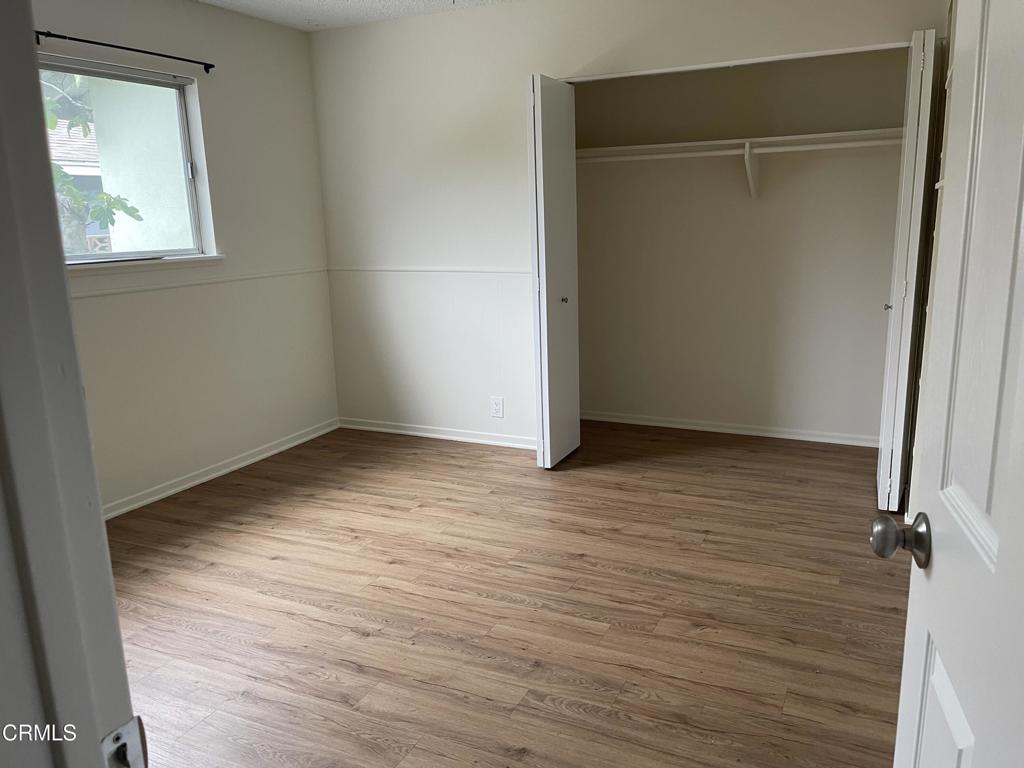 1908 Sorrel Street Camarillo, CA 93010 - Photo 3 of 5 a view of an empty room with wooden floor and a window