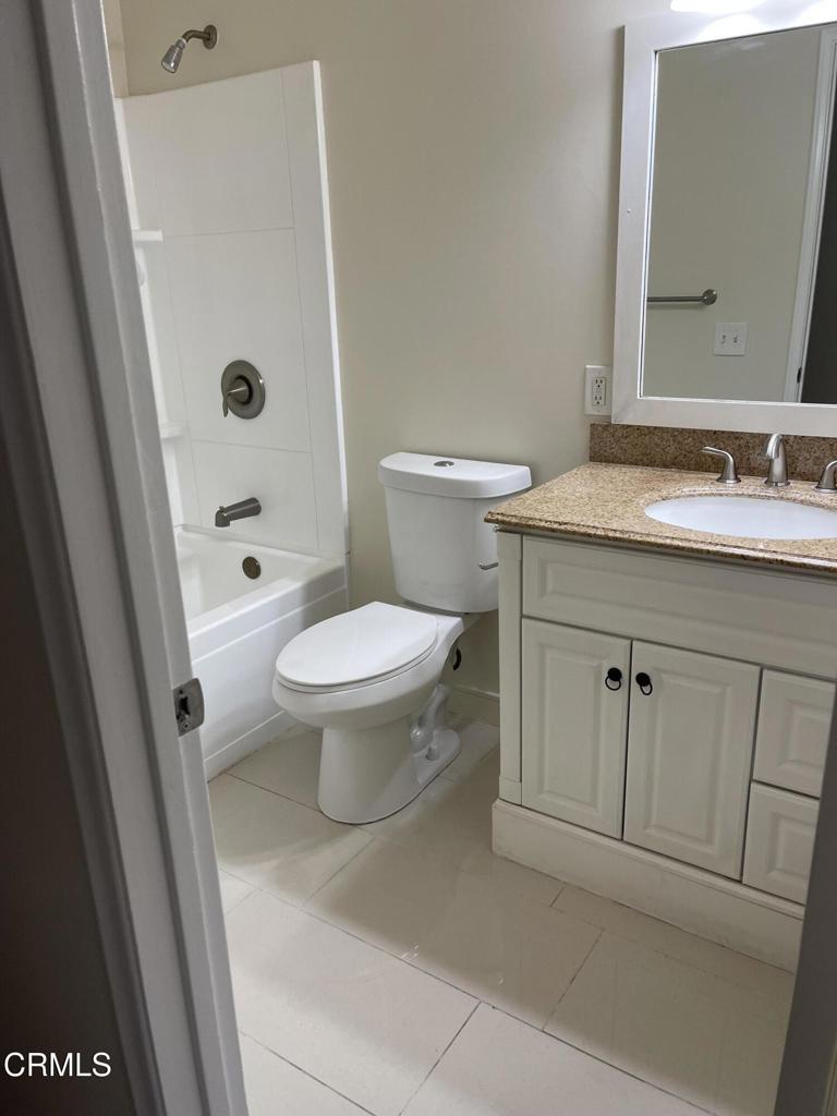 1908 Sorrel Street Camarillo, CA 93010 - Photo 4 of 5 a bathroom with a granite countertop sink toilet and shower