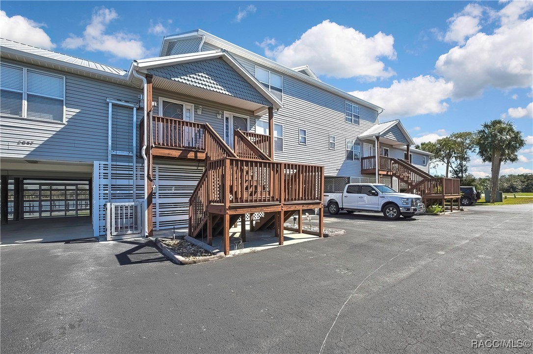 2855 North Rivers Edge Boulevard, Unit 213 Crystal River, FL 34429 - Photo 4 of 62 a view of a car park in front of house