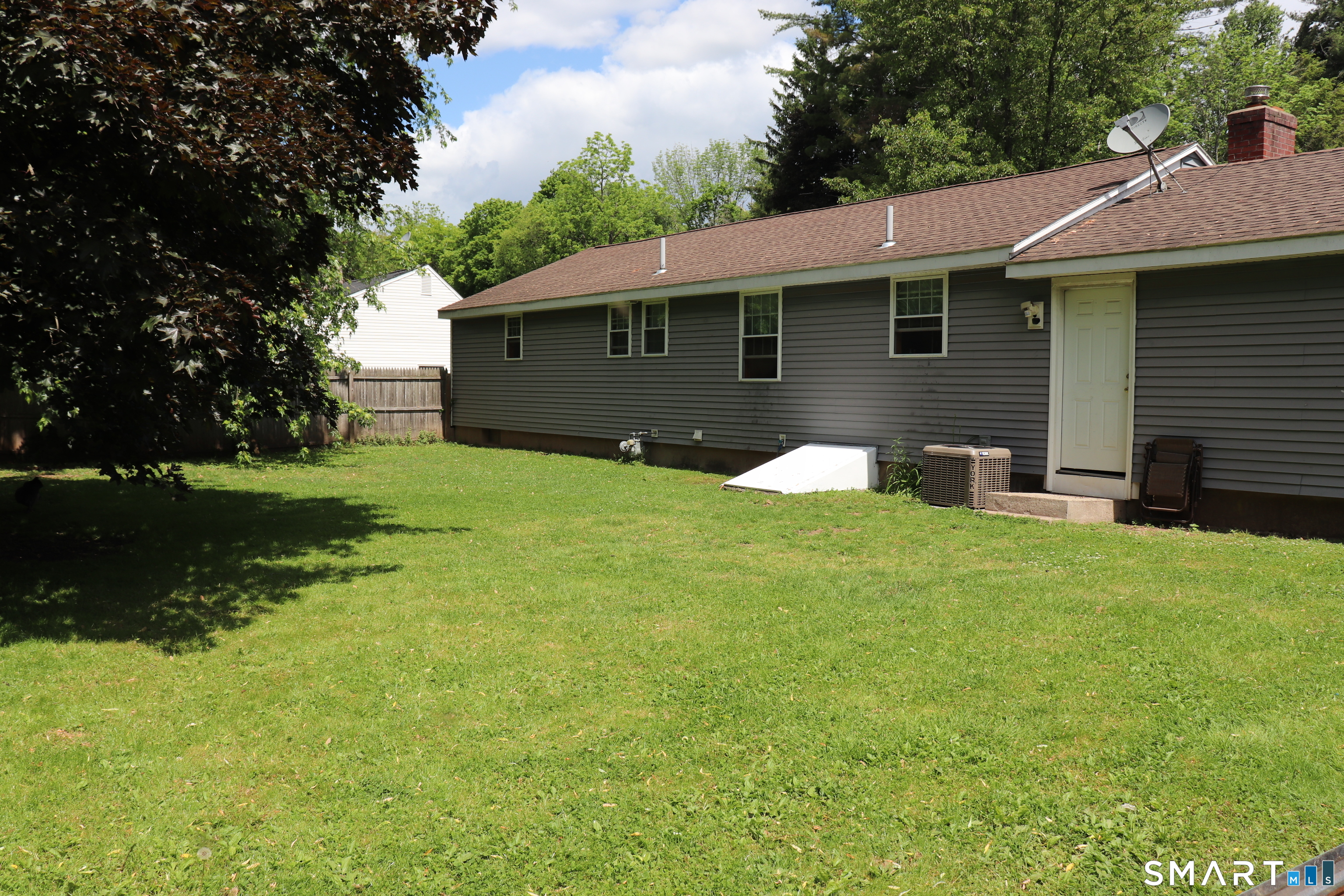 308 Abbe Road Enfield, CT 06082 - Photo 3 of 33 a front view of house with yard and green space